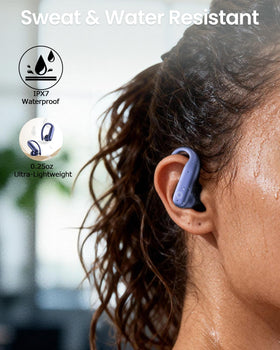 LEEMC earbuds in a hand for scale showing compact lightweight design and portability