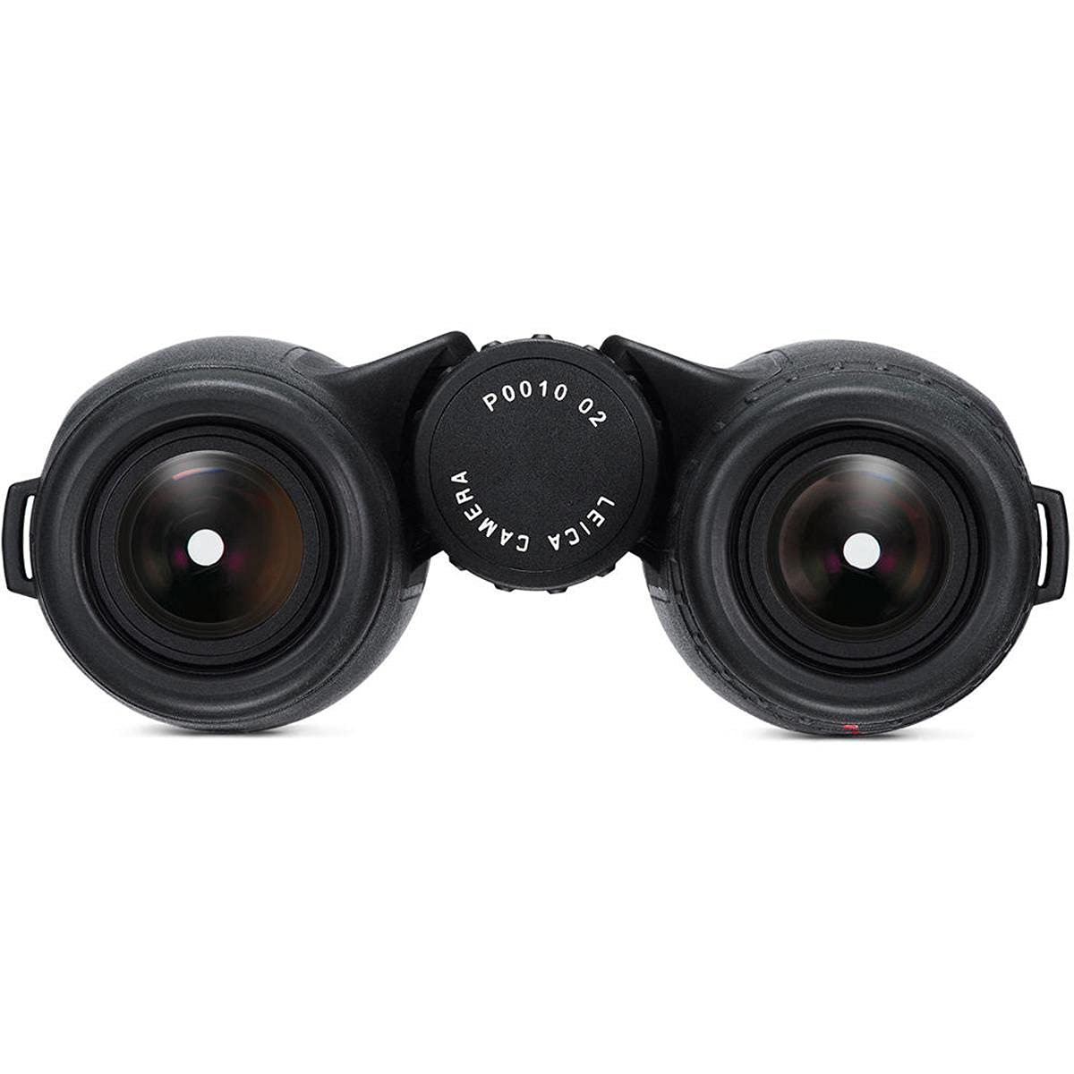 Binocular in use with a steady grip on outdoor scenery.