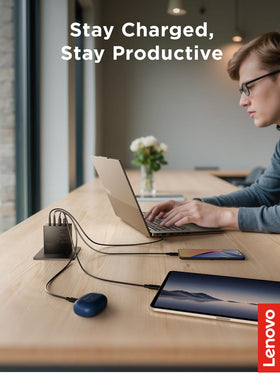 Lenovo 100W charging a laptop on a desk for reliable workstation power