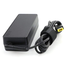 Lenovo adapter on a travel-ready desk setup near a ThinkPad.