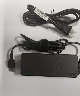 Lenovo adapter includes power cord for convenient charging setup.