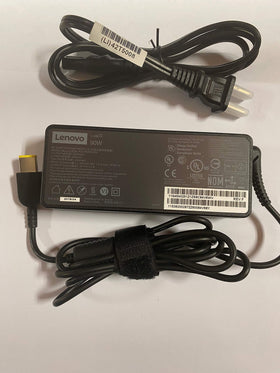 Lenovo 90W Slim Tip adapter side ports showcase durable build.