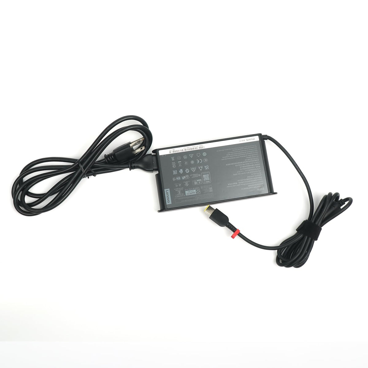 Lenovo adapter held in hand showing compact scale and portability benefit