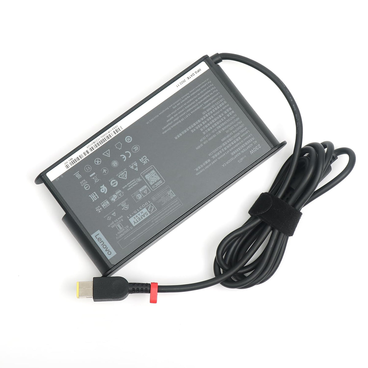 Lenovo power brick side profile showing low-profile shape for easy packing benefit