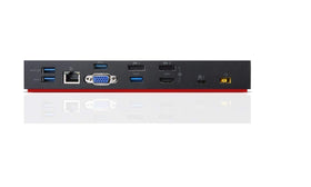 Lenovo dock beside notebook for scale illustrating compact desktop convenience