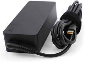 Lenovo adapter plugged into wall powering laptop for fast, steady charging
