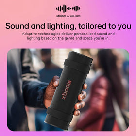 LG xboom Grab with water splashing to show LG water resistance keeps music playing