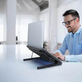 LIANGSTAR ergonomic non-slip baffle keeps laptops secure on angled surfaces.