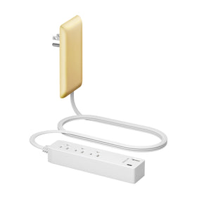 LIDER front matte gold face showing three outlets and two USB ports for sleek power.
