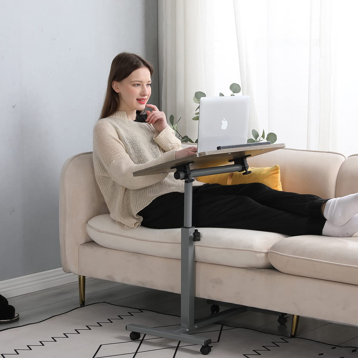 LINGMI in use on a couch with laptop providing a flexible mobile workspace