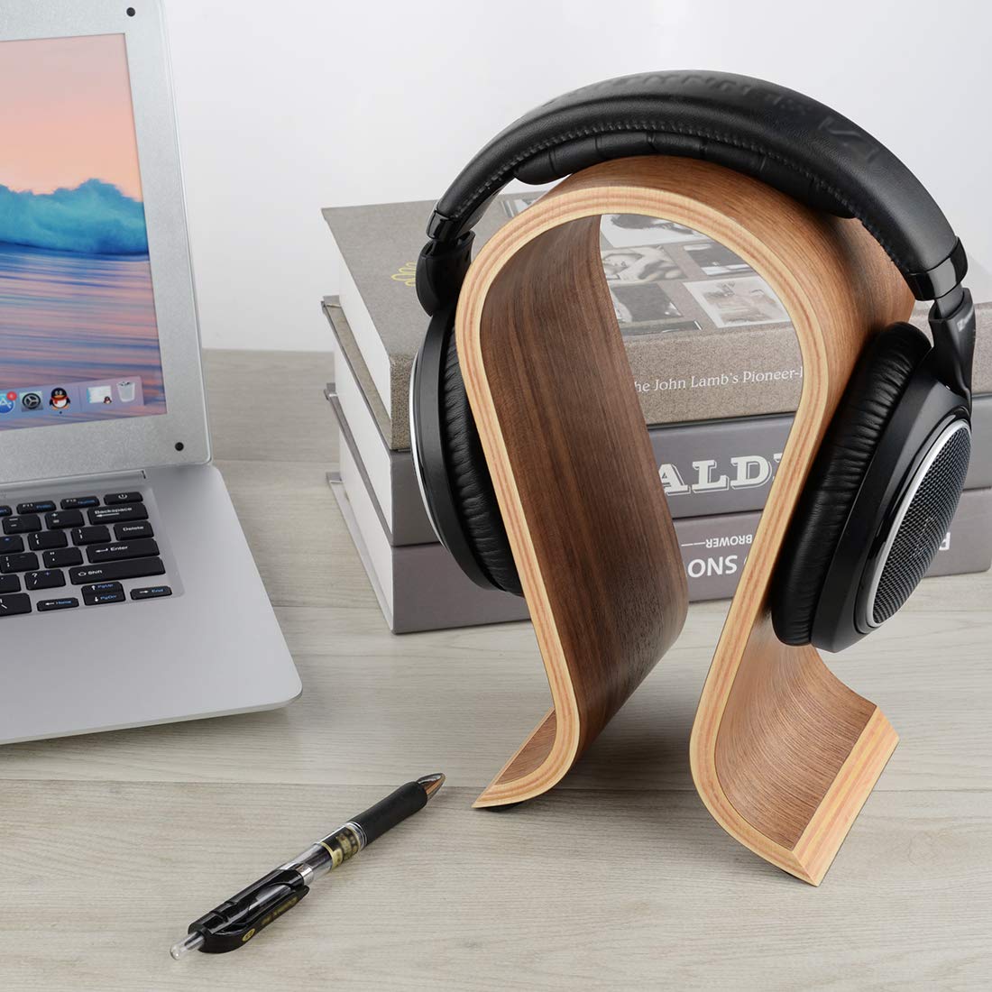 Linkidea Omega stand enhances home studio organization with natural walnut grain.