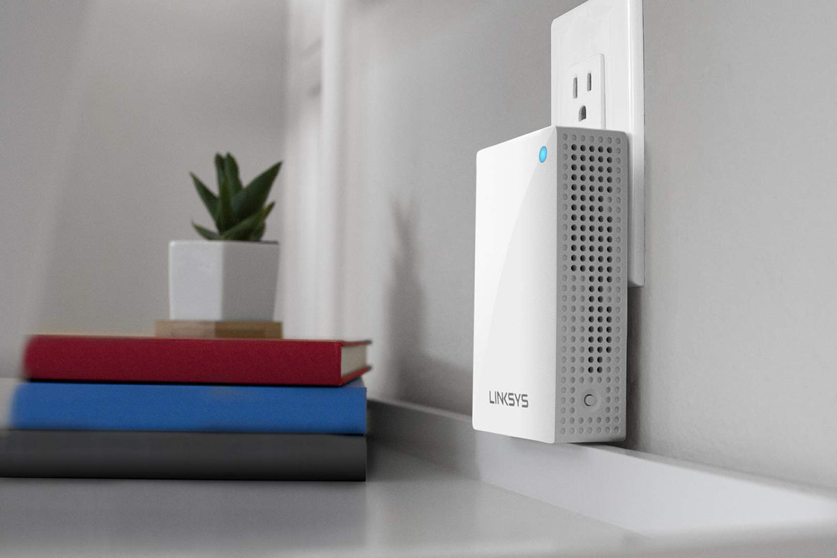 Linksys Velop with Linksys app on phone demonstrating easy setup and management benefit