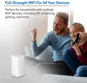 Linksys Velop held in hand to show scale for easy placement and unobtrusive home integration