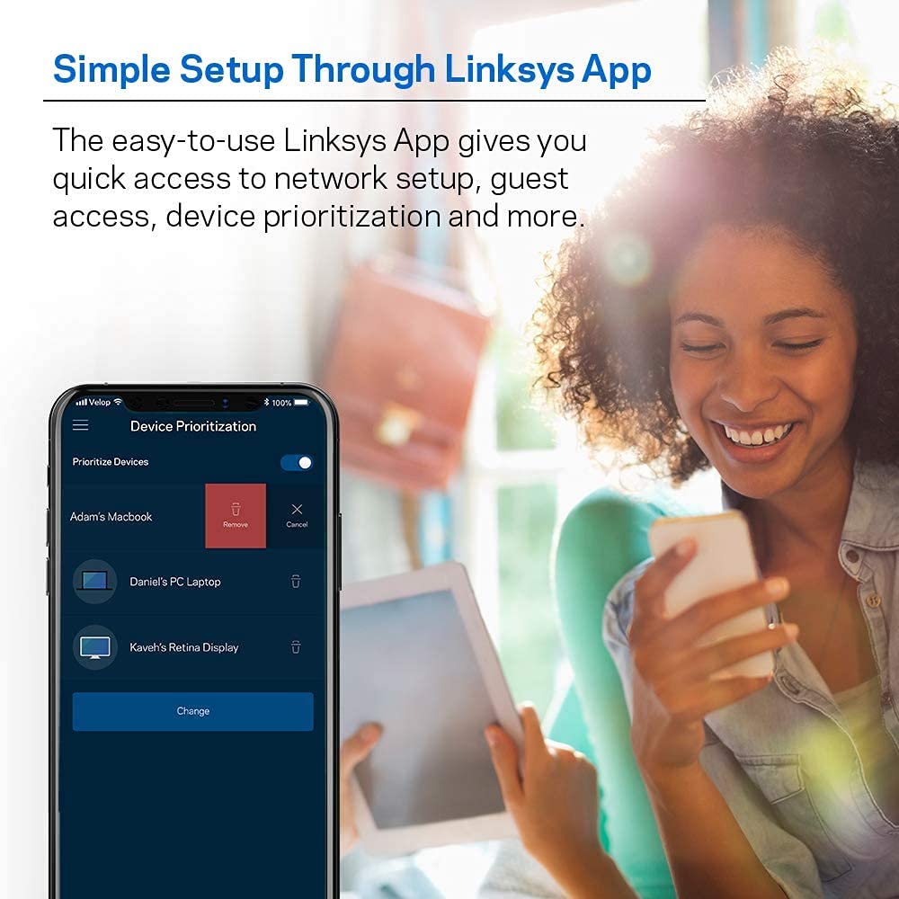 Linksys Velop unit in a modern living room illustrating wireless coverage
