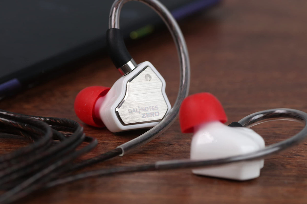 Linsoul Salnotes Zero beside coin to show compact size and easy portability