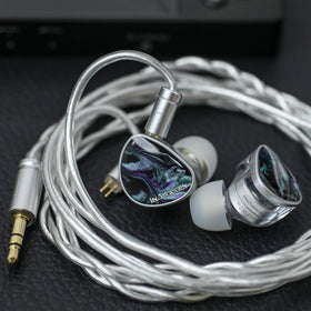 Linsoul DAWN Ms next to coin for scale showing compact size and portability benefit