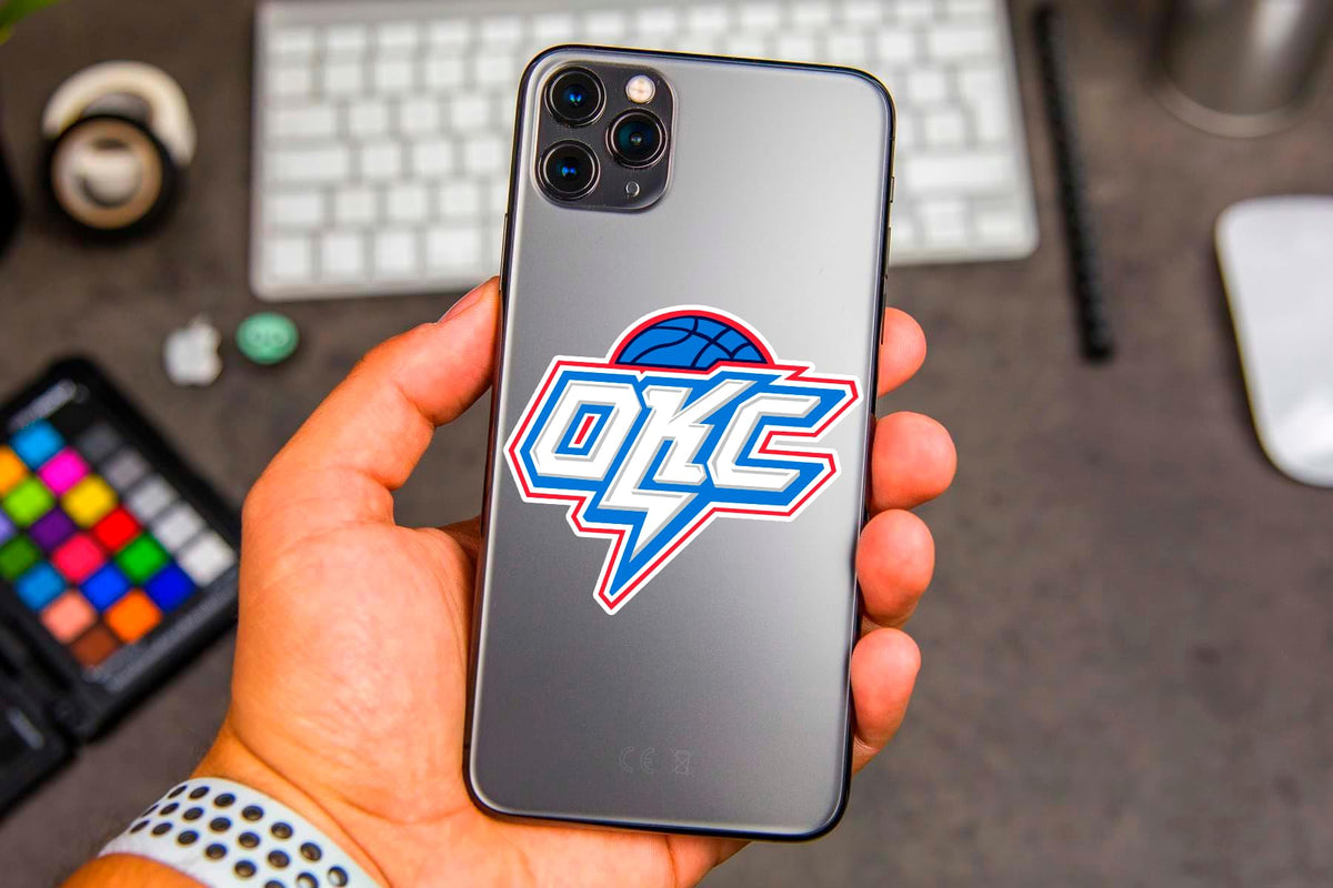 LIONSBRIDGE Oklahoma basketball stickers on skateboard, bold designs for street flair.