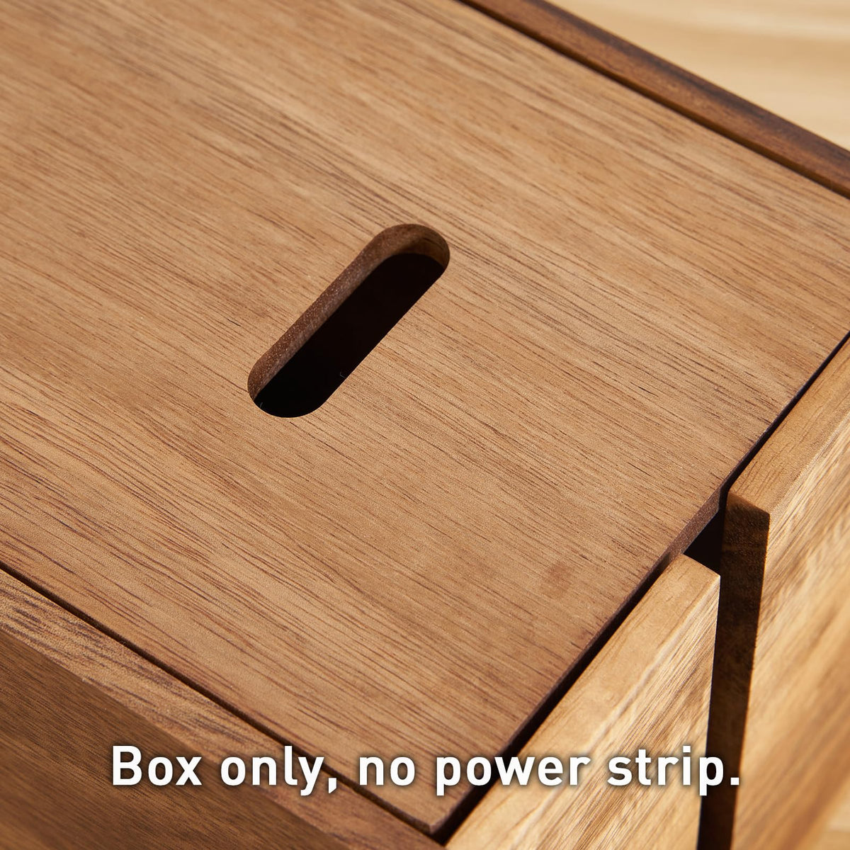 LiTY acacia box next to power strip for scale, showing roomy interior capacity
