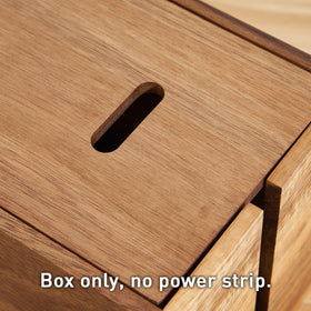 LiTY acacia box next to power strip for scale, showing roomy interior capacity