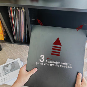 LKKRO storage cabinet holds records, turntable accessories, and compact speakers.