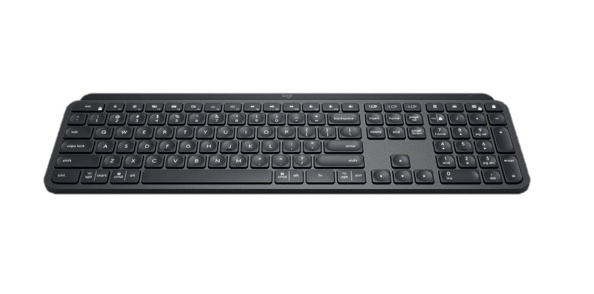 Logitech MX Keys Graphite keyboard on desk in a modern setup