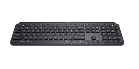 Logitech MX Keys Graphite keyboard on desk in a modern setup