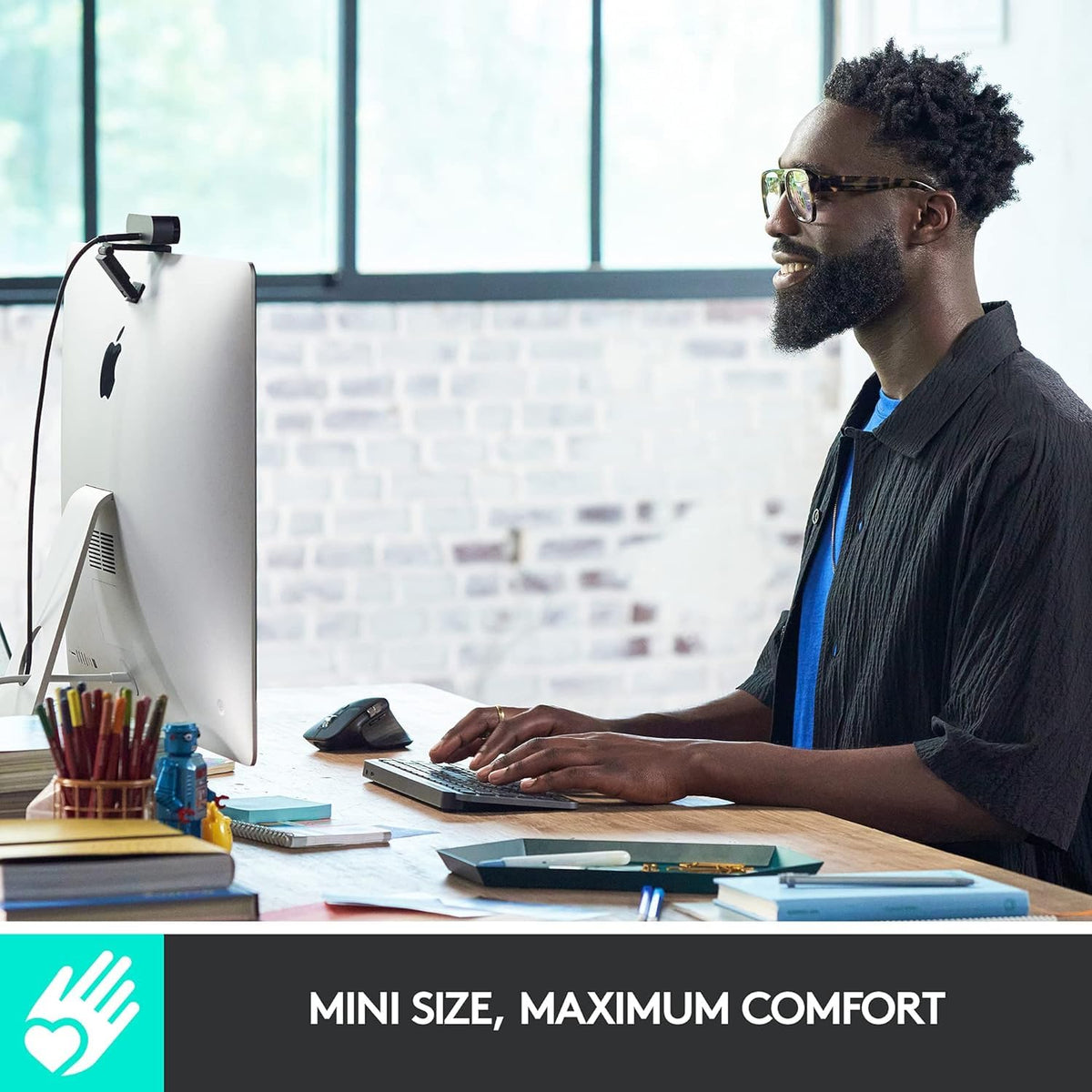 Logitech MX Keys Mini graphite backlit keys illuminated automatically for easier typing.