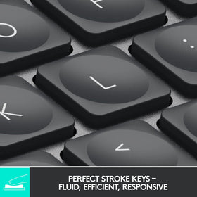 Logitech MX Keys Mini graphite side profile shows slim form for desk space efficiency.