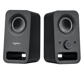 Logitech Z150 front view on desk showing compact black speakers and clear stereo placement benefit