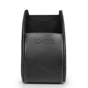 Londo on coffee table holding remotes for easy access during TV time
