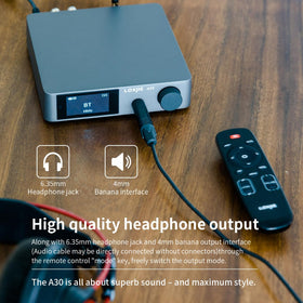 LOXJIE A30 connected to headphones for immersive listening
