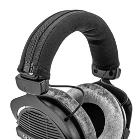 LTYIVABHTTW cover scale next to headphones illustrating slim low-profile fit