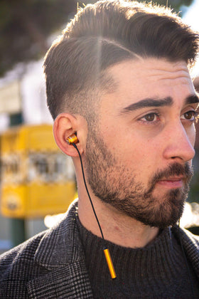 LUDOS Clamor gold side view showcasing compact in-ear design.