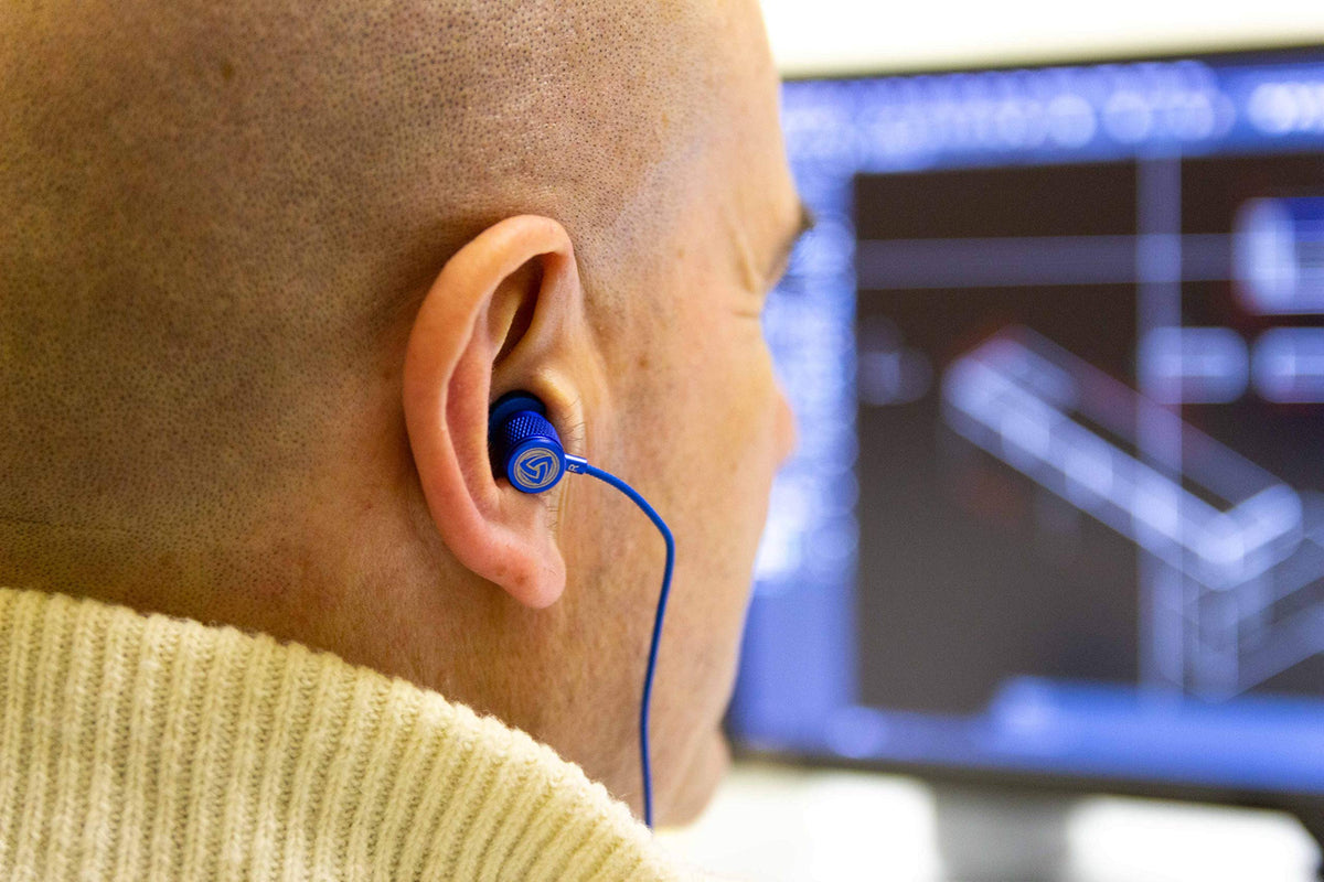 LUDOS Ultra wired earbuds blue memory-foam tips providing a secure, comfortable seal.