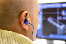 LUDOS Ultra wired earbuds blue memory-foam tips providing a secure, comfortable seal.