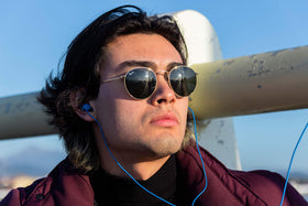 LUDOS Ultra wired earbuds blue side view highlighting the durable cord for active use.