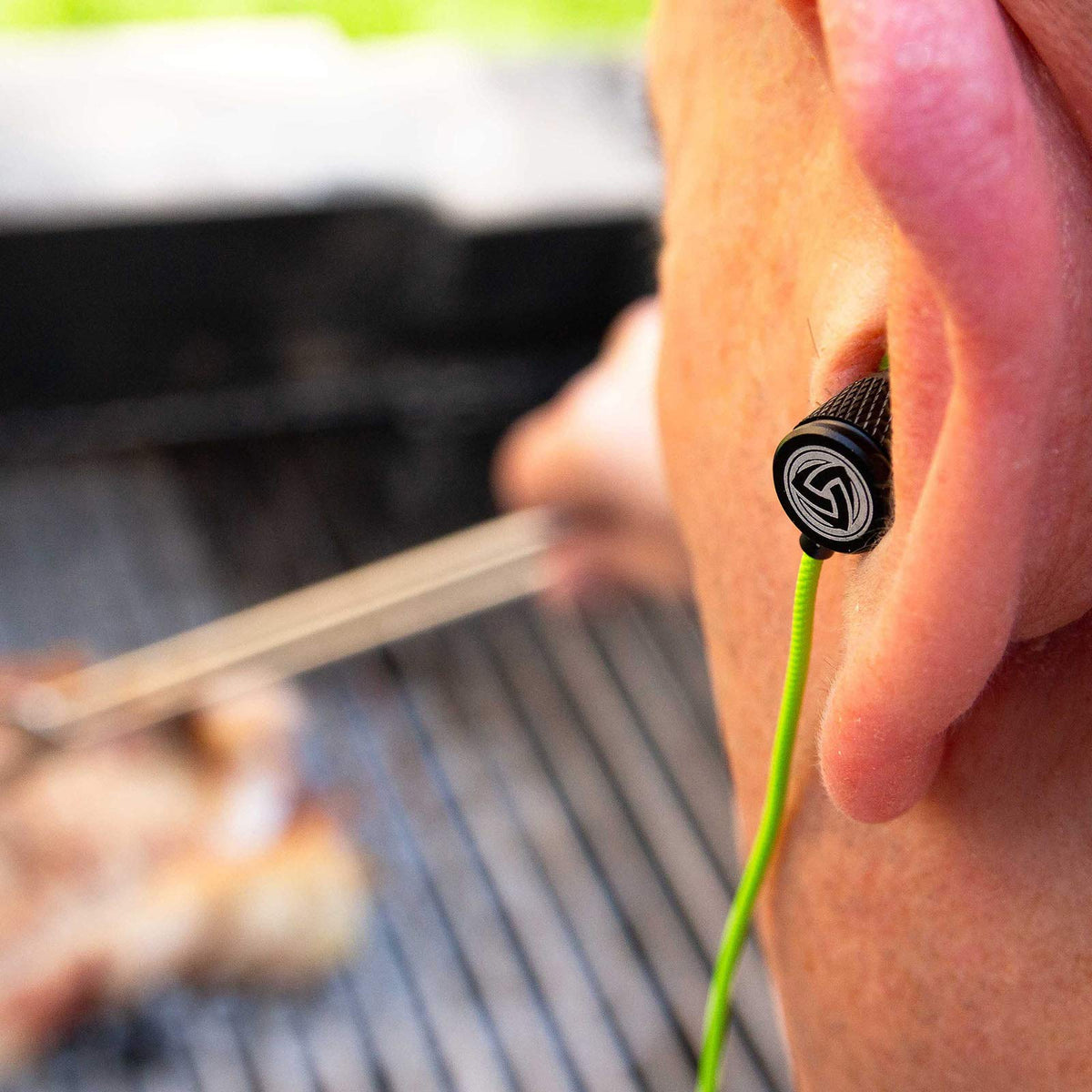 LUDOS Green earbuds with 4.2 ft cord enabling flexible movement.