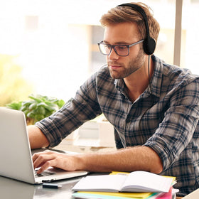 Maeline yellow headphones pack for travel and group activities on campus.