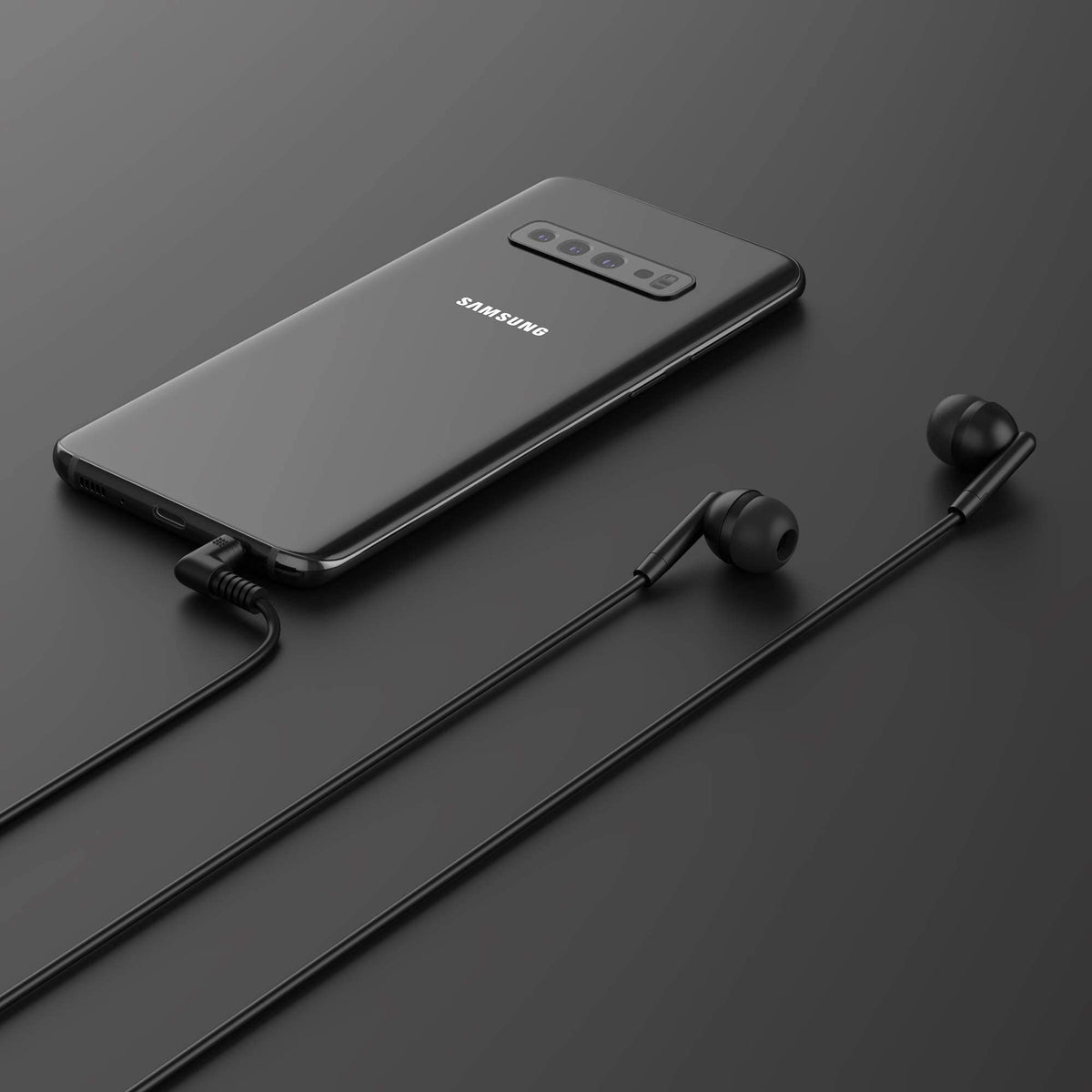 Maeline earbuds next to coin showing compact size and portability