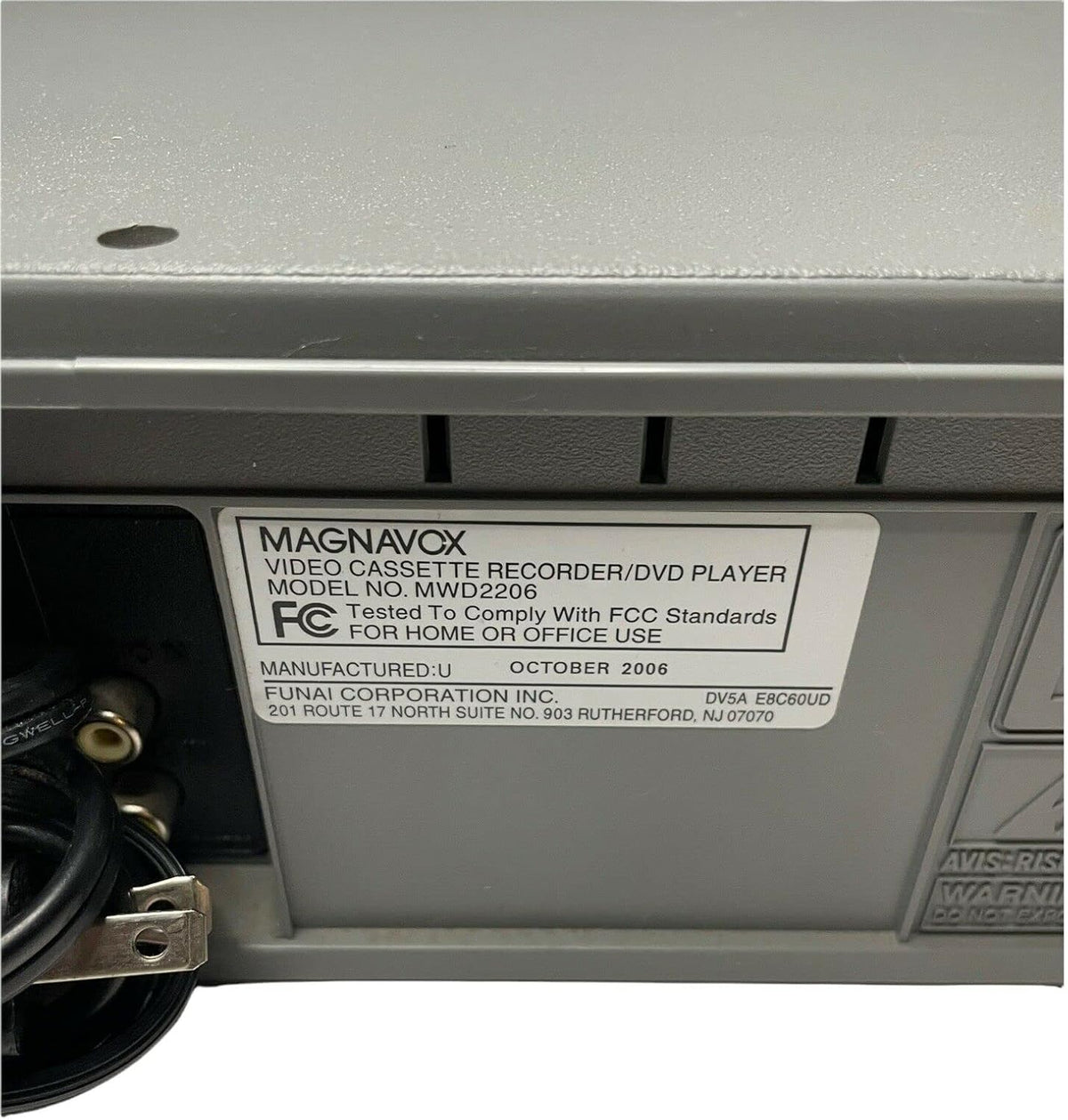Magnavox MWD2206 renewed label indicating refurbished quality and testing.