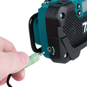Makita RM02 auxiliary port supports MP3 or iPod playback.