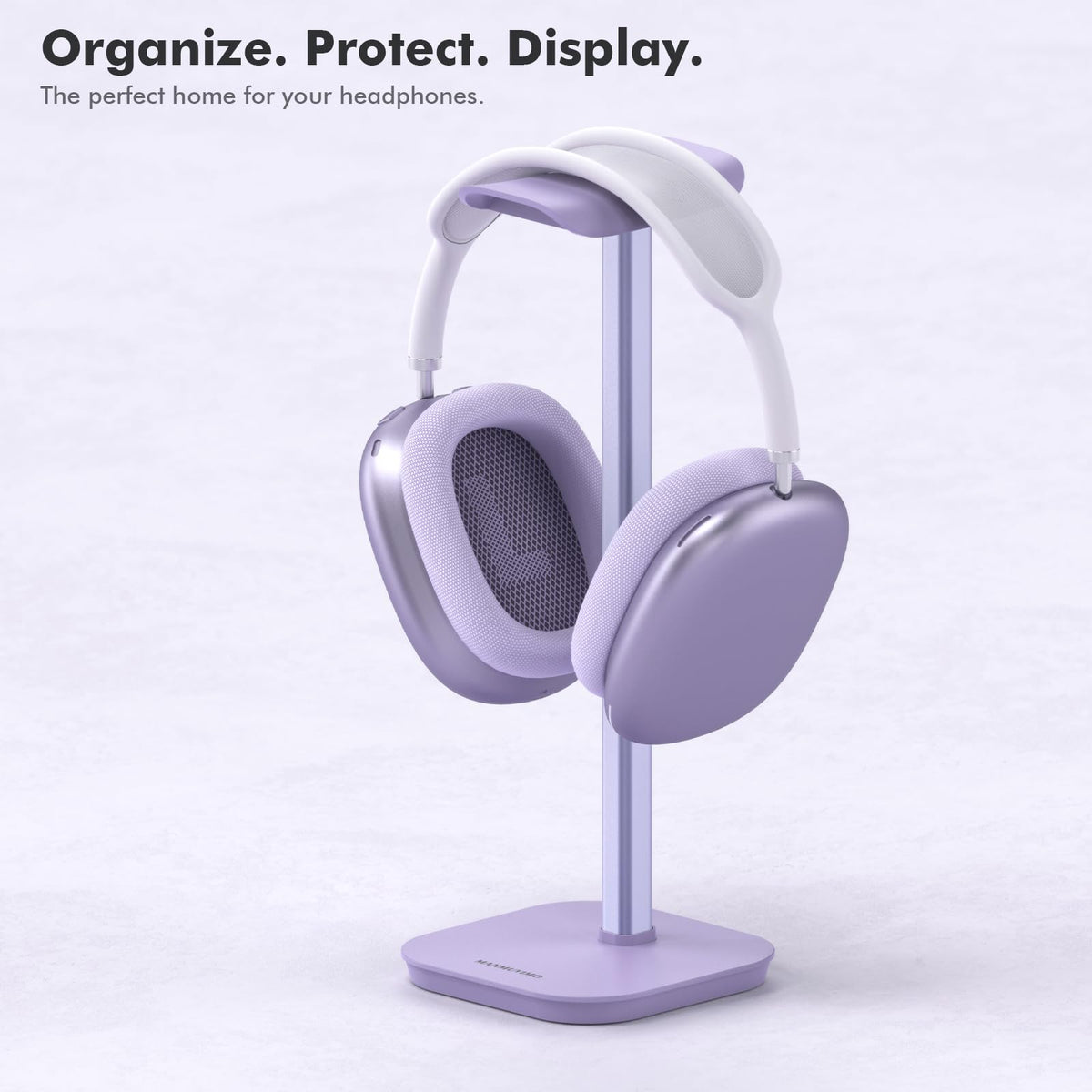 MANMUVIMO stand placed on a home office desk for organized gear.