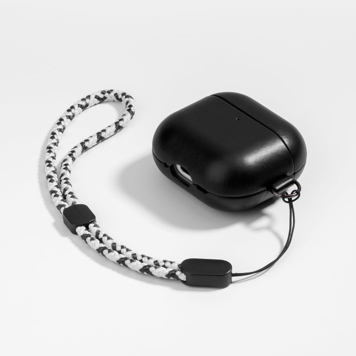 Maogoam AirPods 4 veg-tanned leather cover highlighting evolving patina.