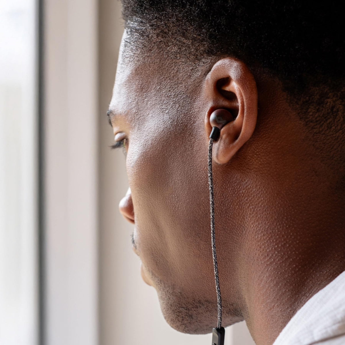 Black Marley Smile Jamaica earbuds ready for portable listening.
