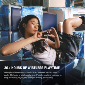 Marshall Minor IV earbuds in use showcasing seamless Bluetooth multipoint connectivity.