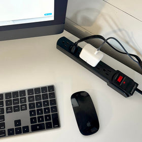 Maxxima beside ruler showing 24-inch cord length and compact scale for placement planning