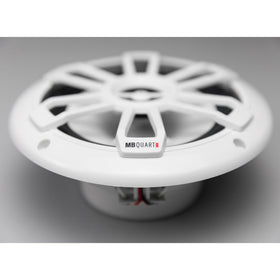 MB Quart with ruler for scale highlighting compact 6.5-inch fitment benefit