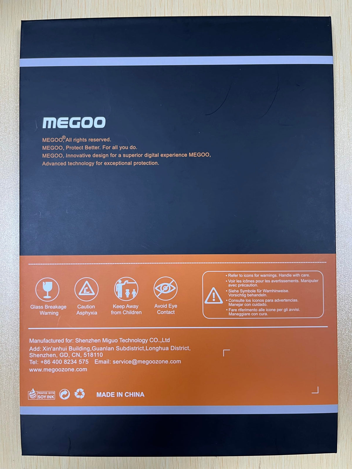 Megoo installed with protective case demonstrating case compatibility and screen coverage