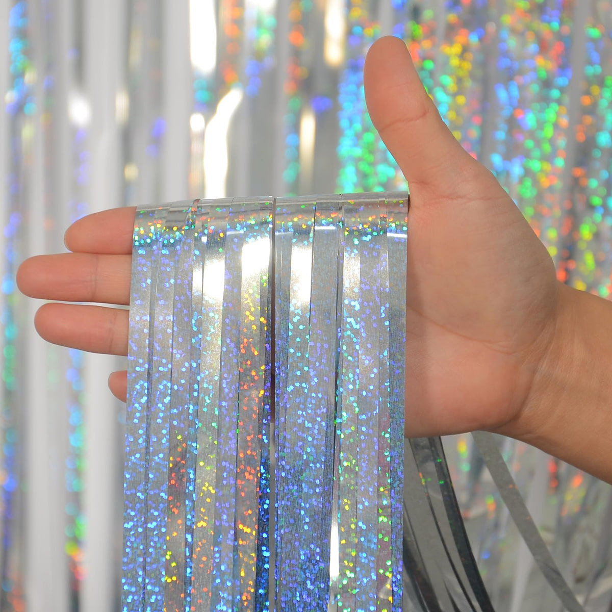 Melsan foil fringe curtain rope-hanging option enables flexible layouts.