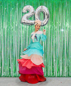 Melsan photo booth setup with props showing vibrant green background for pictures